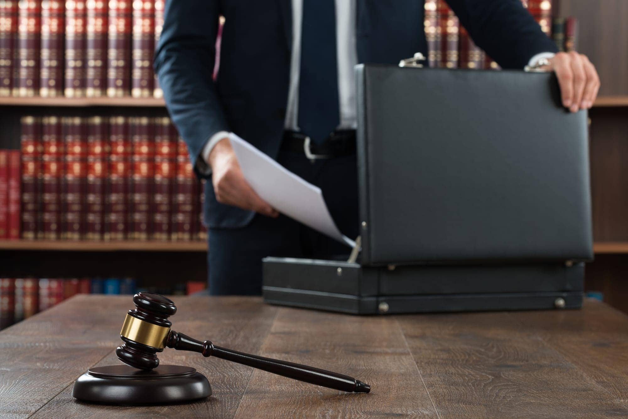 Lawyer Putting Documents In Briefcase Lawyer Working On Tax Case