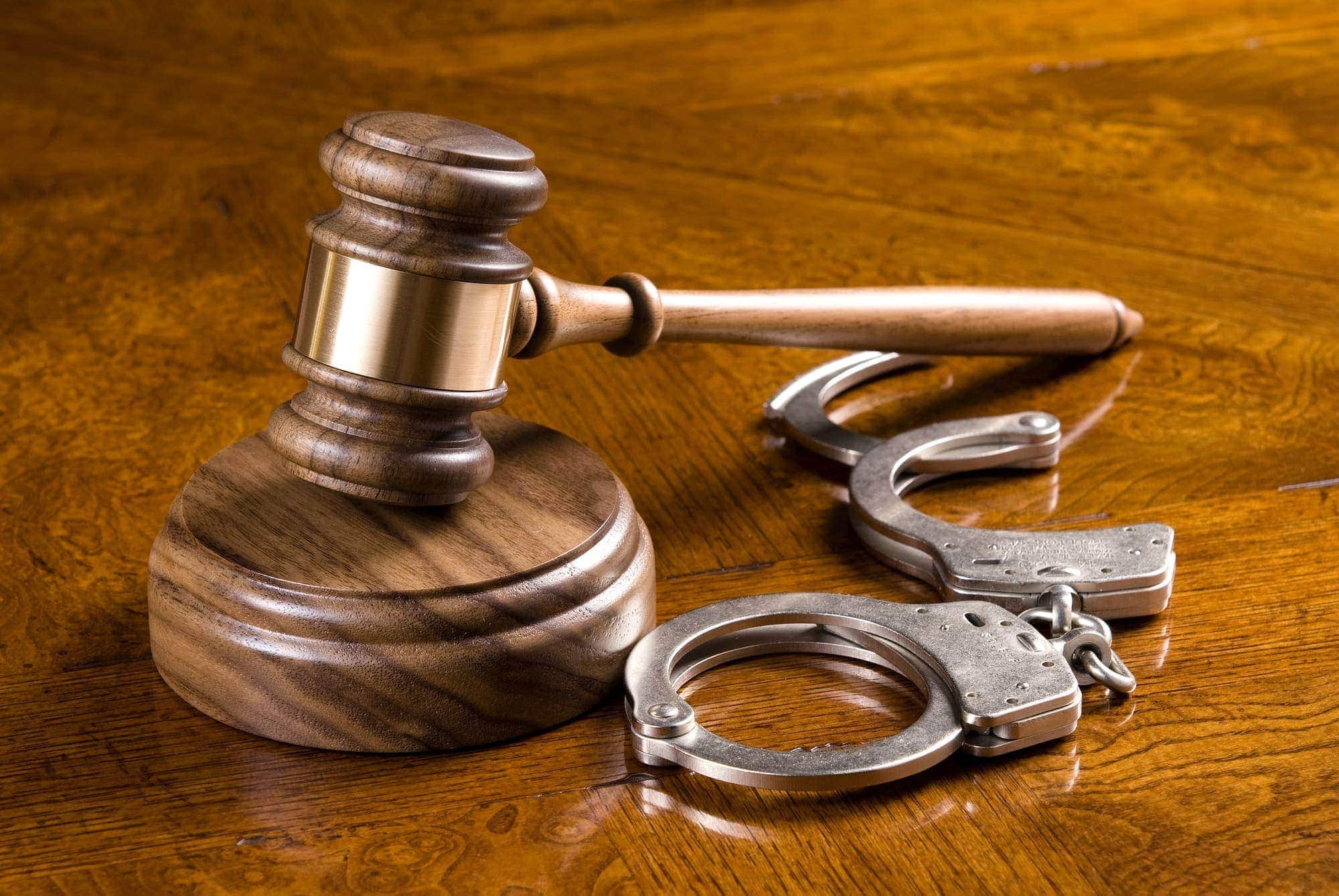 Gavel and handcuffs Ivey McClellan Criminal Defence Attorneys