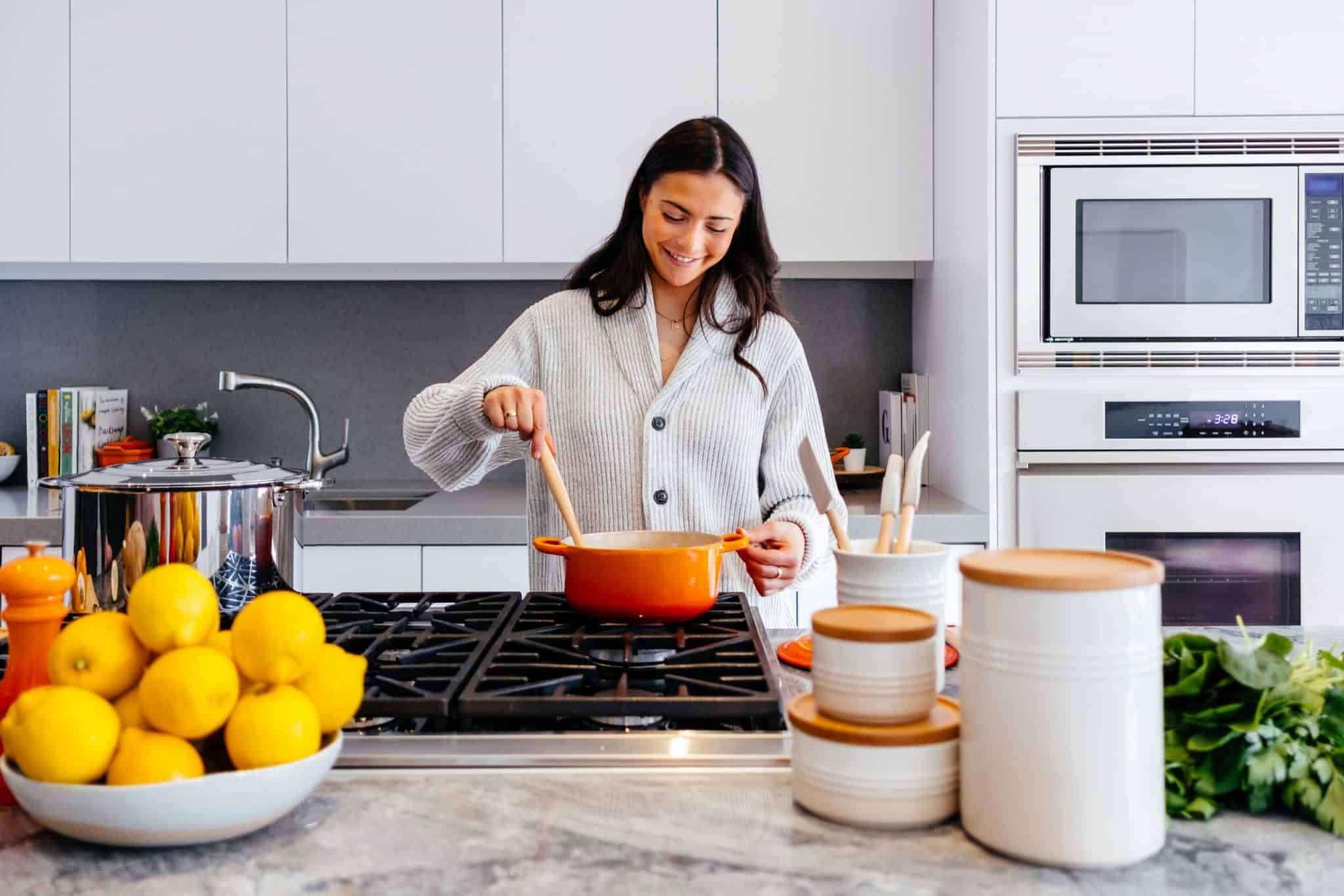 woman cooking in heart healthy kitchen