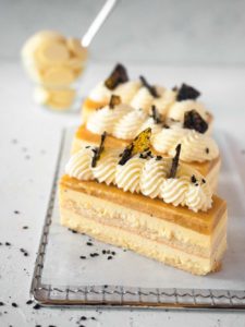 Passionfruit and White chocolate mousse cake with black sesame praline
