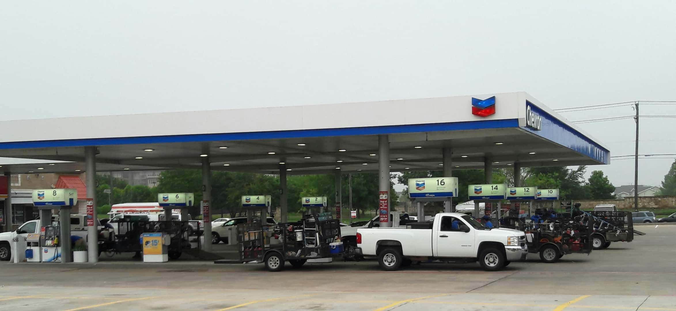 Lawn trucks and trailers at the gas station