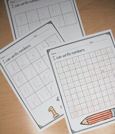 Photo of 3 different samples of number writing from different times in the school year. These pages can easily show growth at parent conferences.