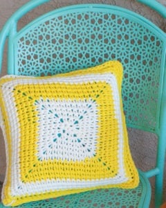 The Sunshine Patio Pillow is an excellent way to brighten up your outdoor living area. THe free crochet pattern only uses one skein of Bernat Maker Outdoor yarn per pillow and has a very unique stitch. This pattern uses very few stitches and is quick and easy. It is great for beginners. #quick #easy #crochet #freepattern #pillow