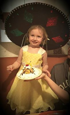 Her first fried ice cream and hat combo :)