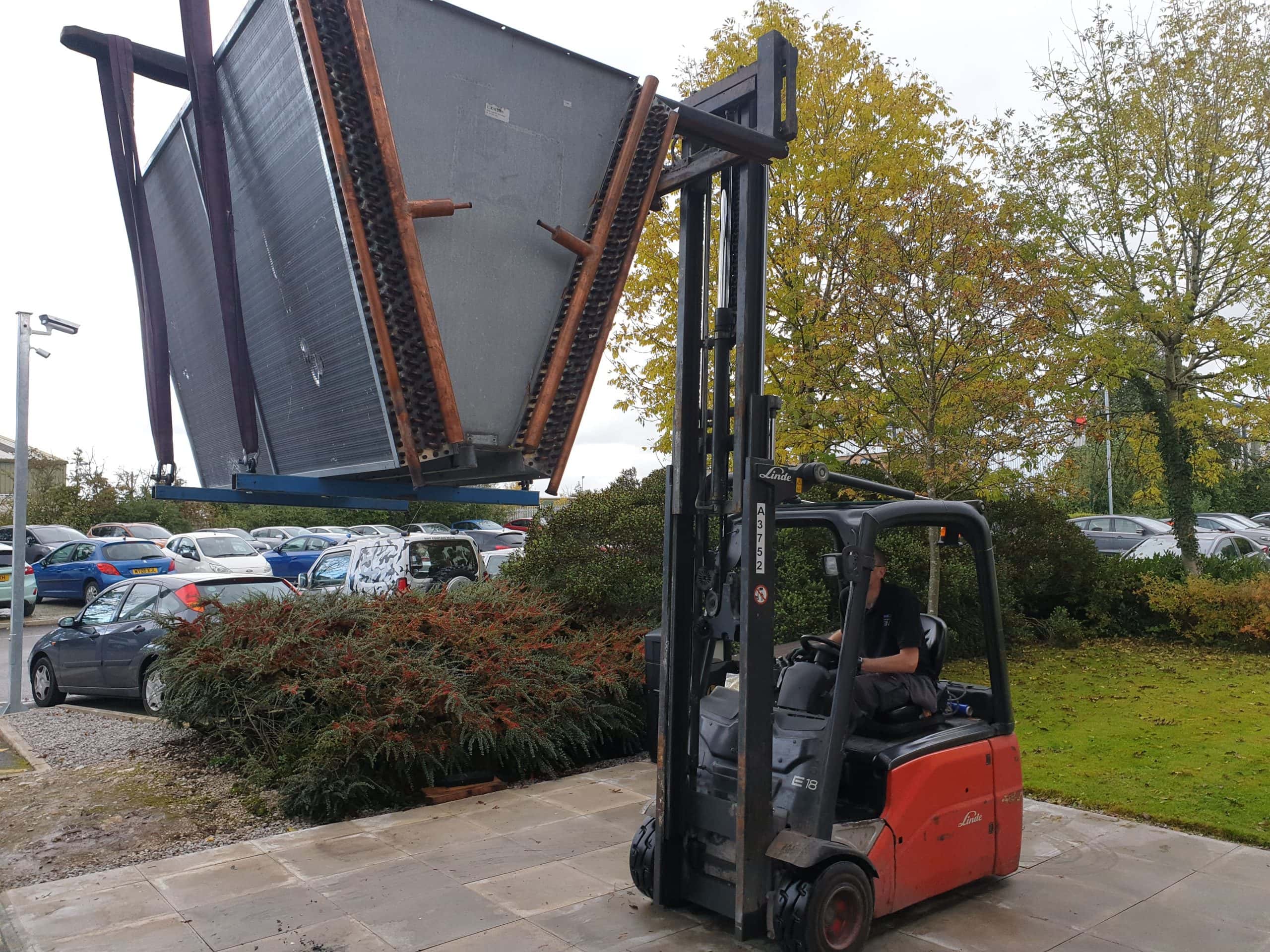 Chiller retrofitting of a bespoke ‘v’ type condenser being lifted into place with a forklift truck