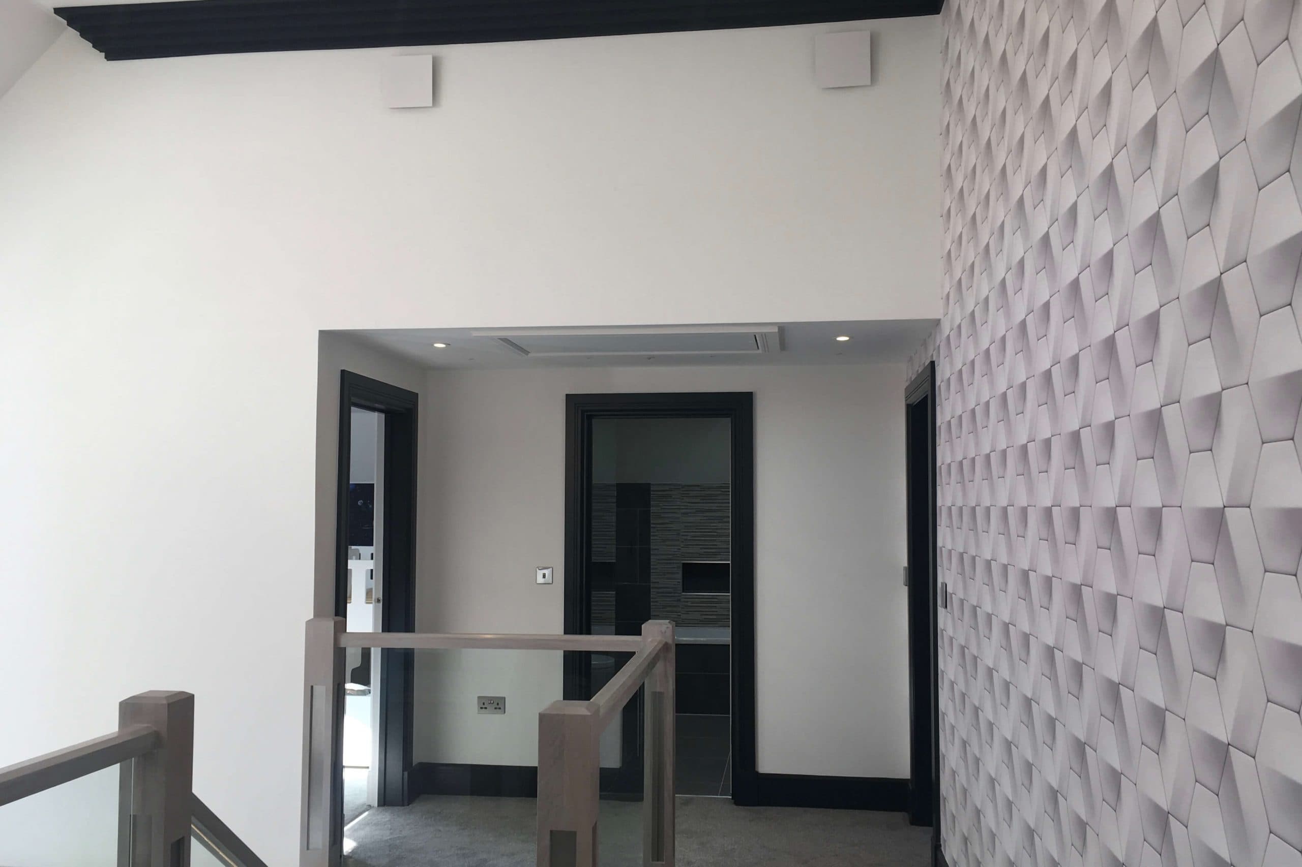 Scandia Hus new build project upstairs landing showing vents high on walls to stream MVHR air flow by SubCool FM