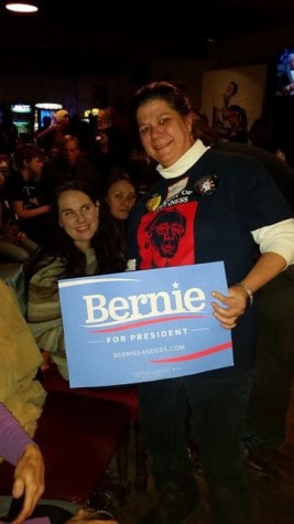 Lillian Potter-Saum, owner of The Local Source on German Street, and friends show support for Sanders.
