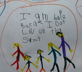 Photo of a student writing samples that says "I am HAPE BECAZ I LIV ON THA STRET" (I am happy because I live on that street.)