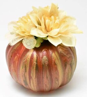 Acrylic Pour Pumpkin topped with faux flowers