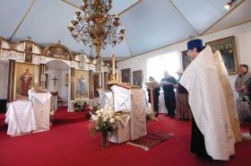File Photo/Peninsula Clarion Father Thomas Andrew and others bless items inside of the Holy Assumption of the Virgin Mary Russian Orthodox Church in April 2010 before they were transferred to the Kenai Cultural and Visitors Center for a summer art gallery show while the church was being renovated. That project was phase one of the church's three-phase project to completely renovate the church. The church is set to receive $230,000 from the Alaska State Legislature's capital budget that would go toward fire and theft prevention systems, among other items, as part of phase two of the renovations.
