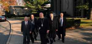 After the closing, a tour was offered of the new property in Uniondale, NY. (L-R) Nikitas Drakotos, Kathy Bartzos, Bishop Andonios, Constantine Rogdakis and Nick Tjartjalis.