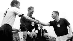 German captain Fritz Walter and his Hungarian counterpart Ferenc Puskas exchange pleasantries.