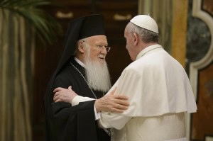 Pope Francis embraces Ecumenical Patriarch Bartholomew of Constantinople, spiritual leader of Orthodox Christians, at the Vatican March 20. The pope met with Patriarch Bartholomew before a meeting with the Christian, Jewish, Muslim, Buddhist, Hindu, Sikh and Jain delegations that had come to the Vatican for his inauguration. (CNS photo/L'Osservatore Romano) (March 20, 2013) See FRANCIS-DIALOGUE March 20, 2013.