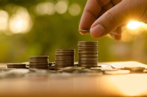 person saving money coins