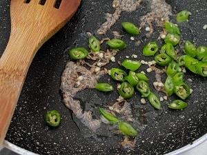 Saute the green chillies in ghee