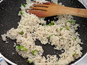 Adding the soaked bhagar to the ghee