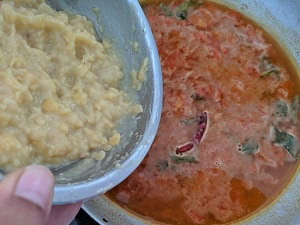 adding cooked lentils to rasam