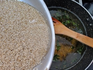 Adding Barnyard Millet to hot water and tempering