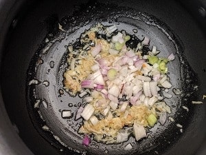 sauteing scallions, garlic and ginger in oil