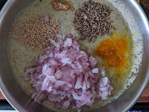 Other ingredients for the moong chilla - onions, cumin, hing, turmeric, sesame seeds