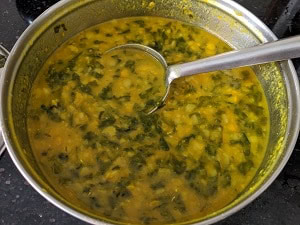 Cooked toor dal and spinach ready for dal palak