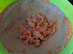 strained bits of the tomato to be discarded