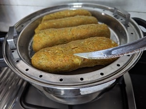 Knife comes out clean - Muthiya is cooked and ready to be cooled, sliced