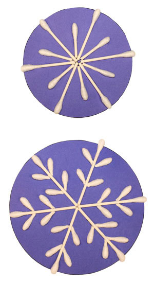 Two snowflakes made with cotton swabs
