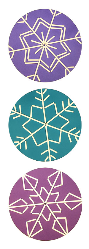 Three snowflakes made with lollipop sticks