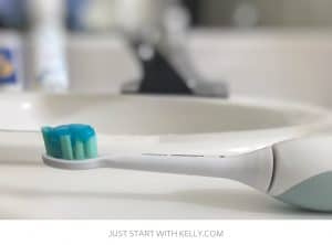 Toothbrush on counter by sink edited