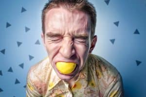 man with lemon in his mouth
