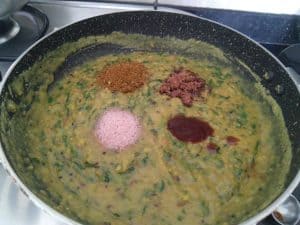 Adding the ambat and goad element of tamarind paste and jaggery for varan recipe