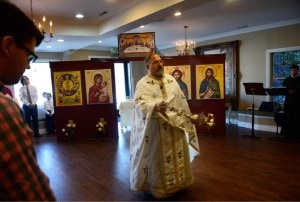 (Scott Sommerdorf | The Salt Lake Tribune) Father Jimi Foreso from St. Catherine Greek Orthodox Church of Greenwood Village, Colorado led the inaugural worship service of the Greek Orthodox community's new Mission Parish at Woods on Ninth, Sunday, August 31, 2014.