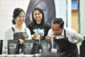 President Jokowi smells the aroma of coffee displayed in a booth, at the opening of the 2019 Skills Festival, at Kota Kasablanka, Jakarta, Saturday (9/2). (Photo by : Jay/ PR Division)