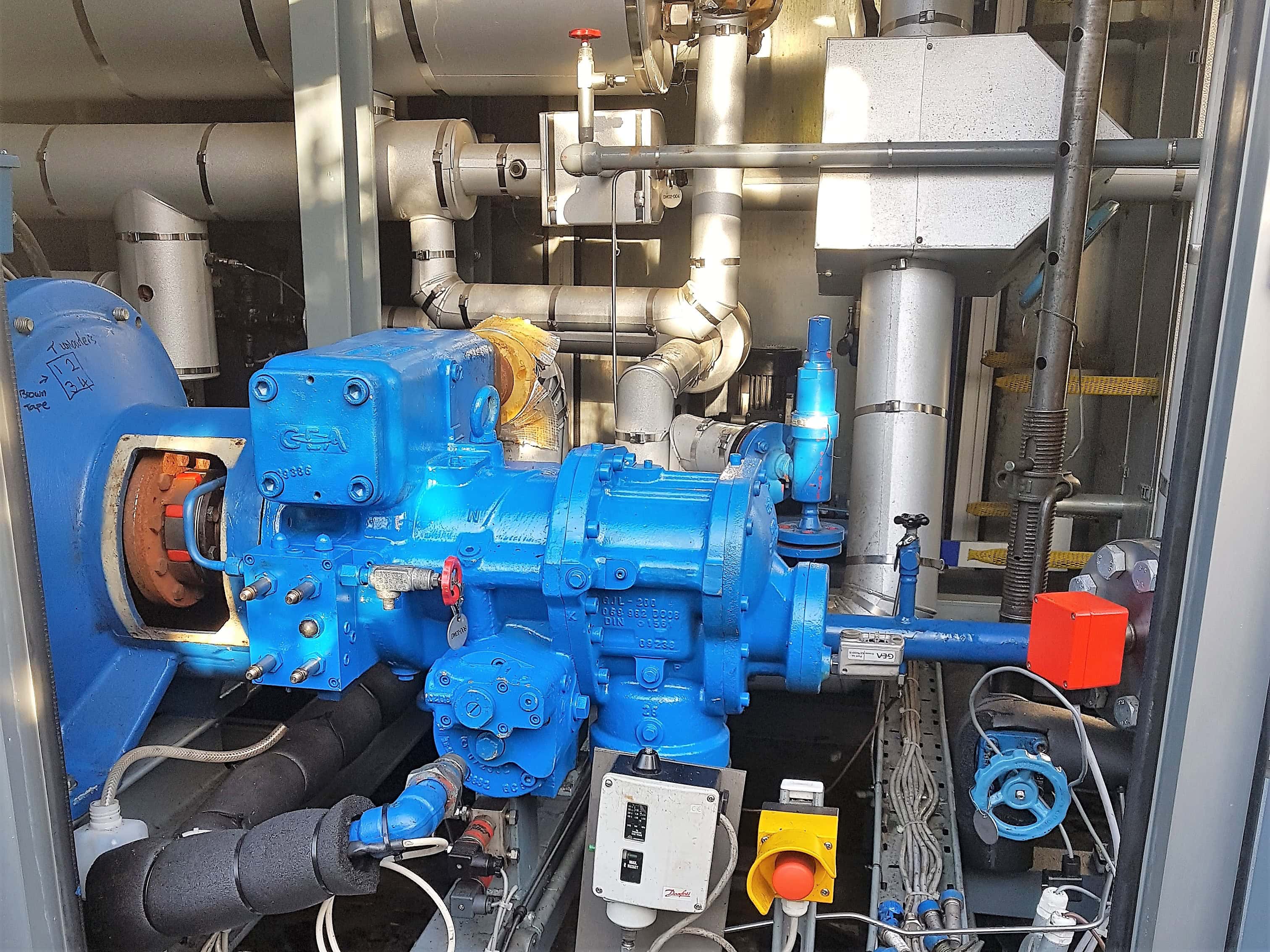 Blue Grasso industrial refrigeration compressor being prepared to be lifted out