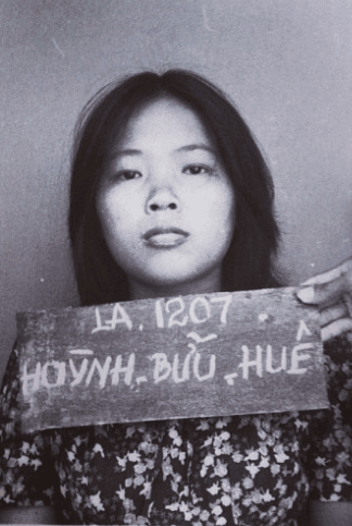 An intake photo of the author's mother, Hue, at a refugee camp in Malaysia.