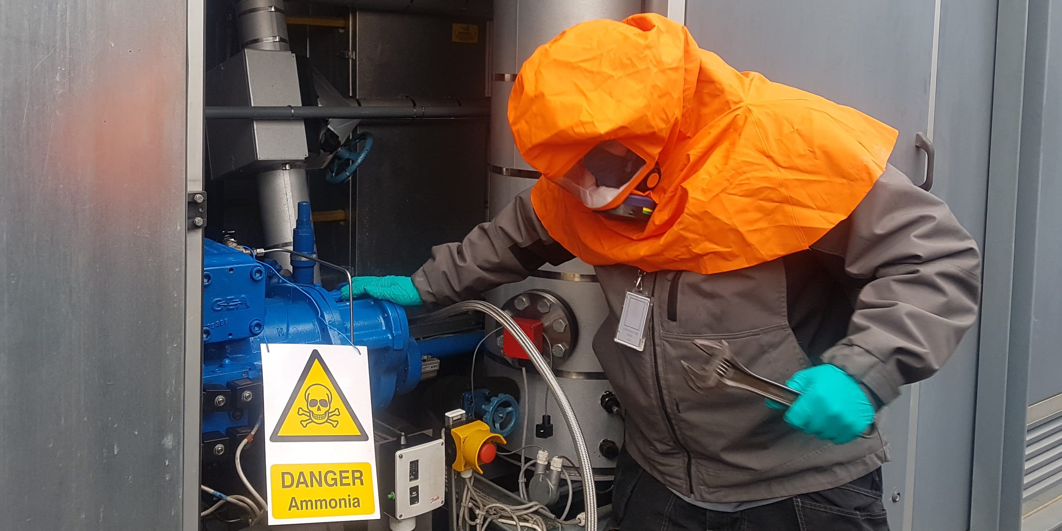 Engineer with orange escape hood breaking into the system