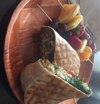 Pesto chicken wrap with a side of fruit from local cafe Mellow Moods.