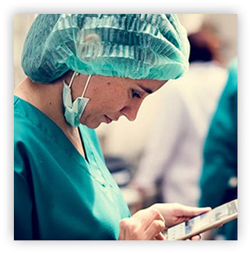 about_pic_3 medical professional looking at smartphone