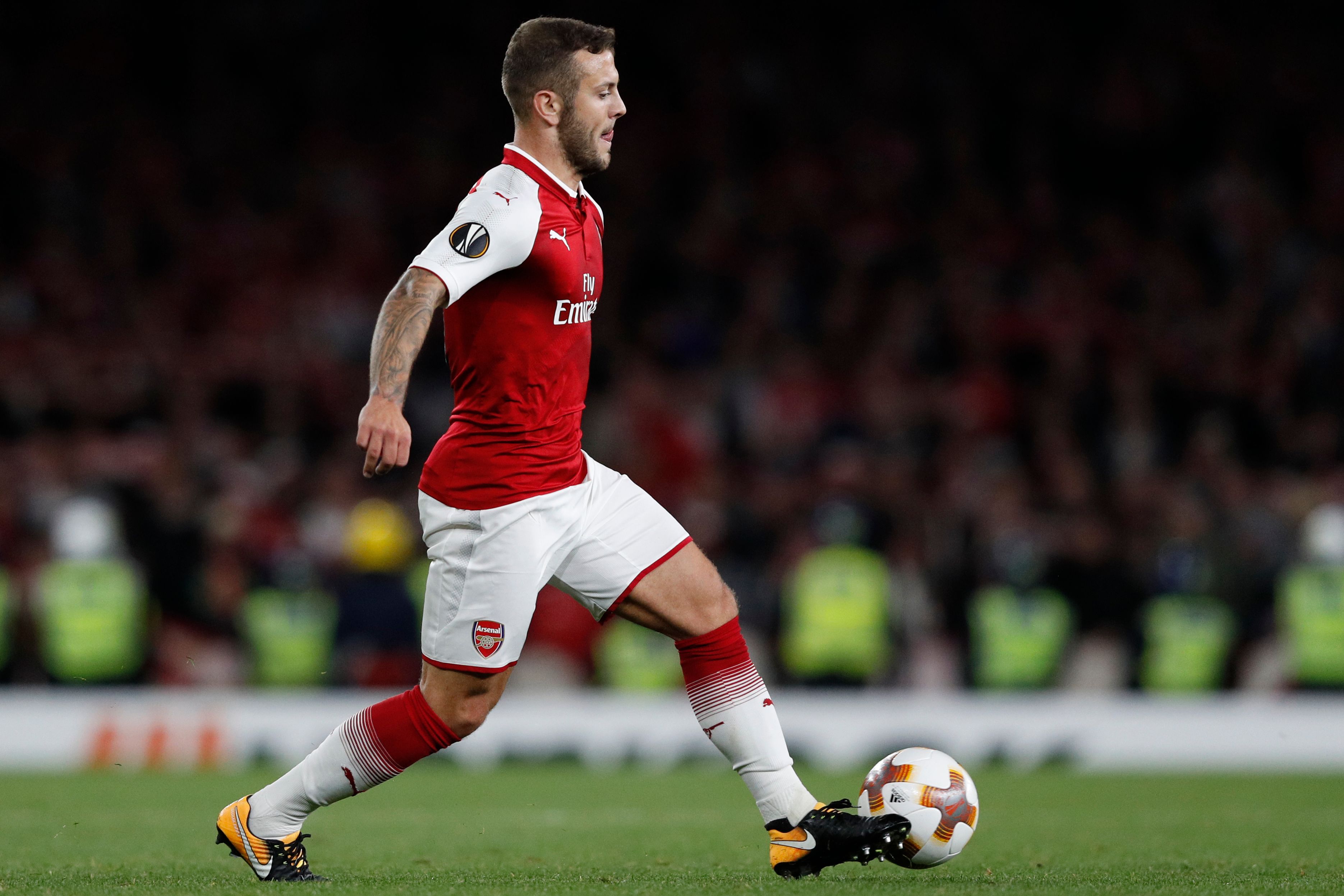 Arsenal's English midfielder Jack Wilshere runs with the ball during the UEFA Europa League Group H football match between Arsenal and FC Cologne at The Emirates Stadium in London on September 14, 2017. / AFP PHOTO / Adrian DENNIS (Photo credit should read ADRIAN DENNIS/AFP/Getty Images)