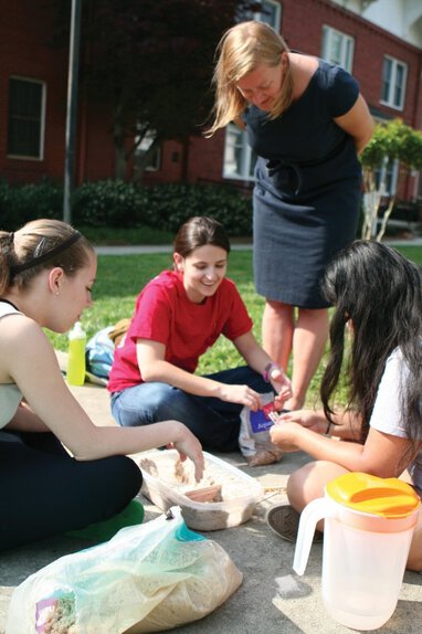 Dr. Heather Casey looks on at the dam construction project of students, from left, Suzanna Broadwell, Chloe Golden and Savannah Long. Dr. Heather Casey looks on at the dam construction project of students, from left, Suzanna Broadwell, Chloe Golden and Savannah Long.