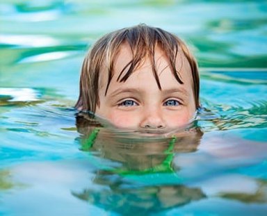 girl swimming and smiling eyes