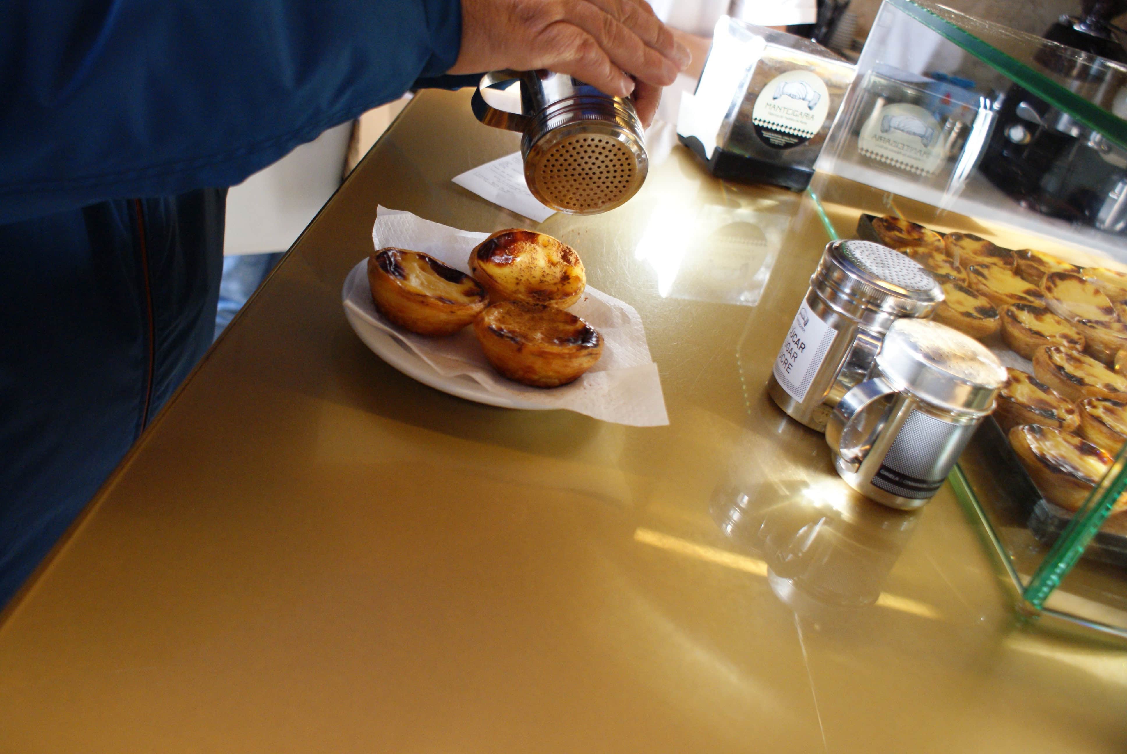 Eating Pasteis de Nata in Lisbon