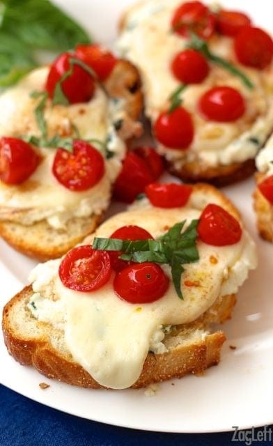 Four slices of Caprese Toast on a plate