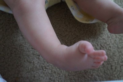 When he gets excited and kicks, this is as straight as he can extend