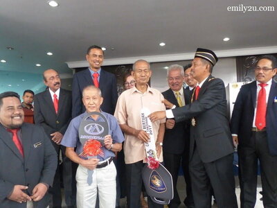 5. Ariffin Abdullah wins the car while Ang Ah Bah rides home the Modenas motorcycle