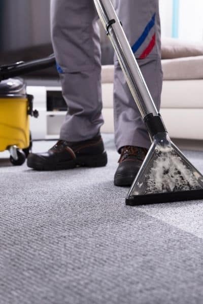 Professional carpet cleaner on Berber carpet