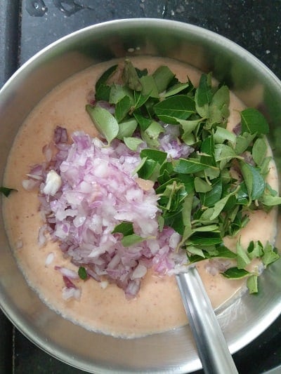 Onions and curry leaves to adai batter