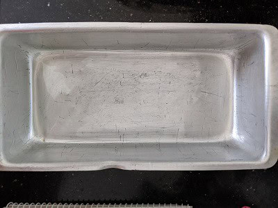 Grease the baking tin with oil before baking.