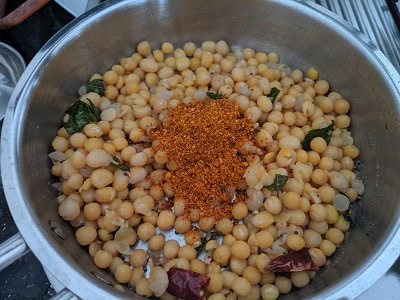 Add the sundal masala to the cooked peas